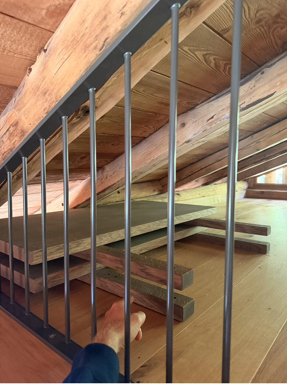 The Barn dining table extension leaves stored on the mezzanine