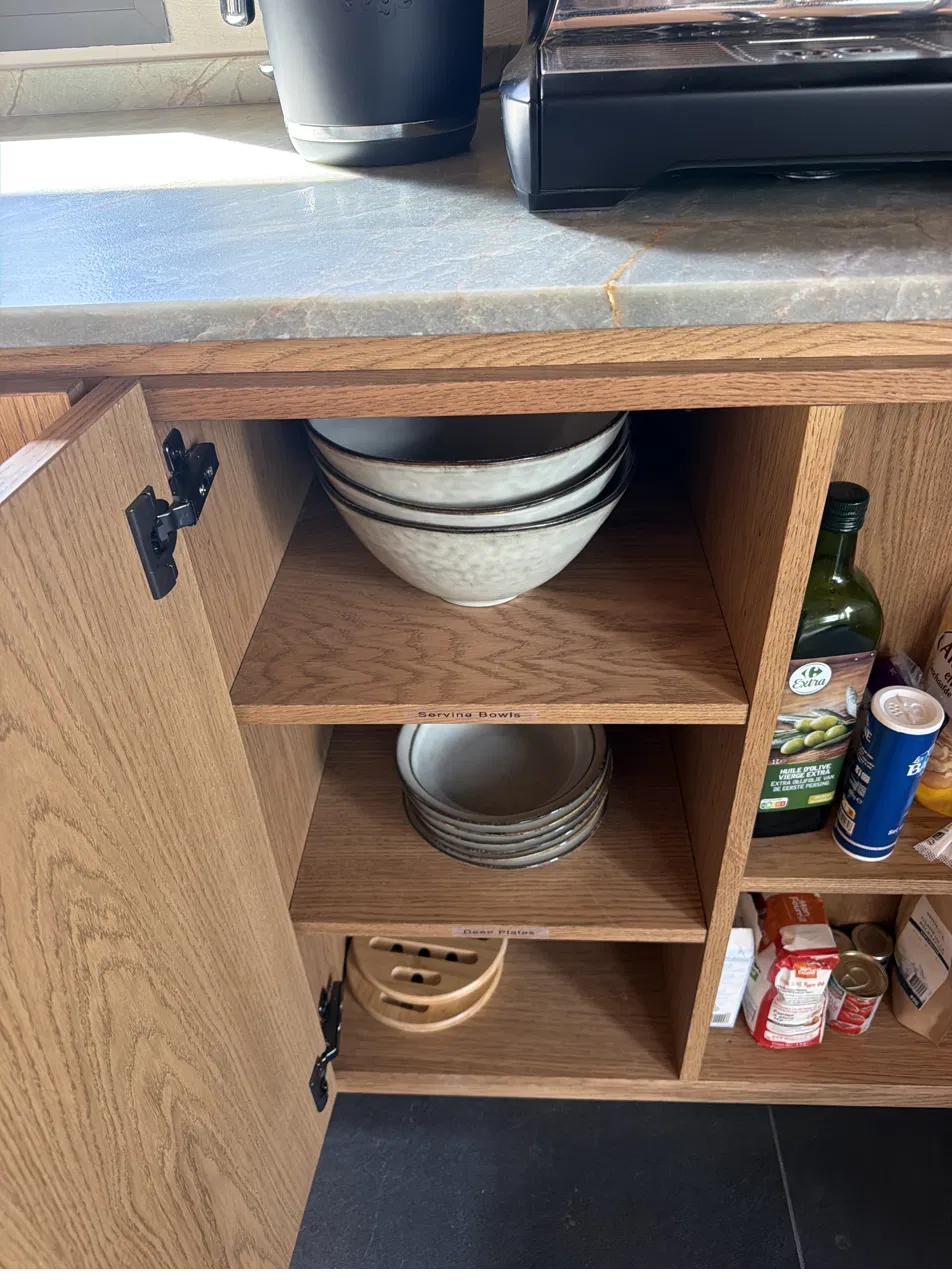 Serving bowls cupboard below The Nest coffee machine